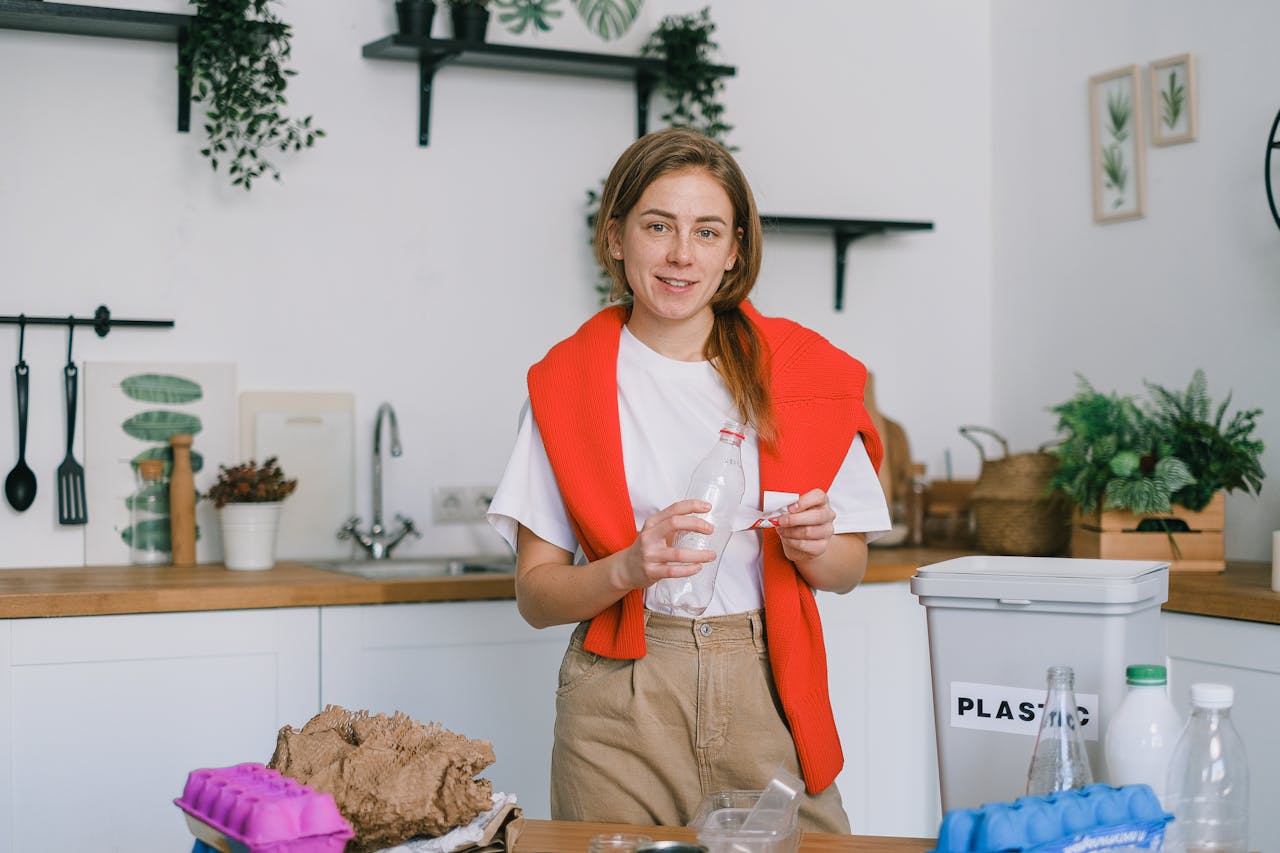 Photo by SHVETS production: https://www.pexels.com/photo/smiling-woman-stacking-paper-litter-for-reuse-7512807/