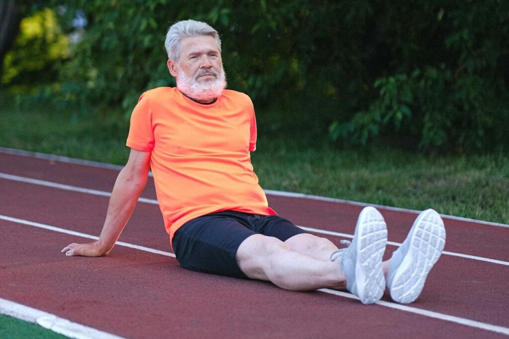 Photo by Anna Shvets: https://www.pexels.com/photo/senior-man-in-sportswear-sitting-on-stadium-5067747/