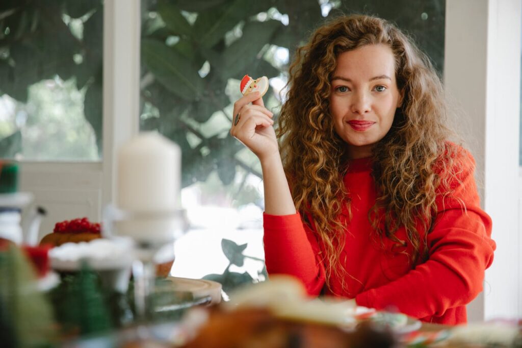 Photo by Tim Douglas : https://www.pexels.com/photo/content-woman-with-cookie-in-hand-6210707/