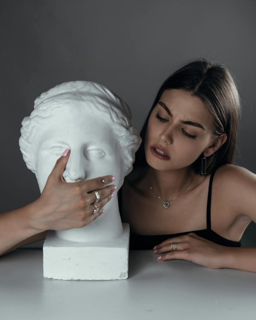 Photo by Elijah O'Donnell: https://www.pexels.com/photo/young-woman-with-bust-sculpture-5022459/