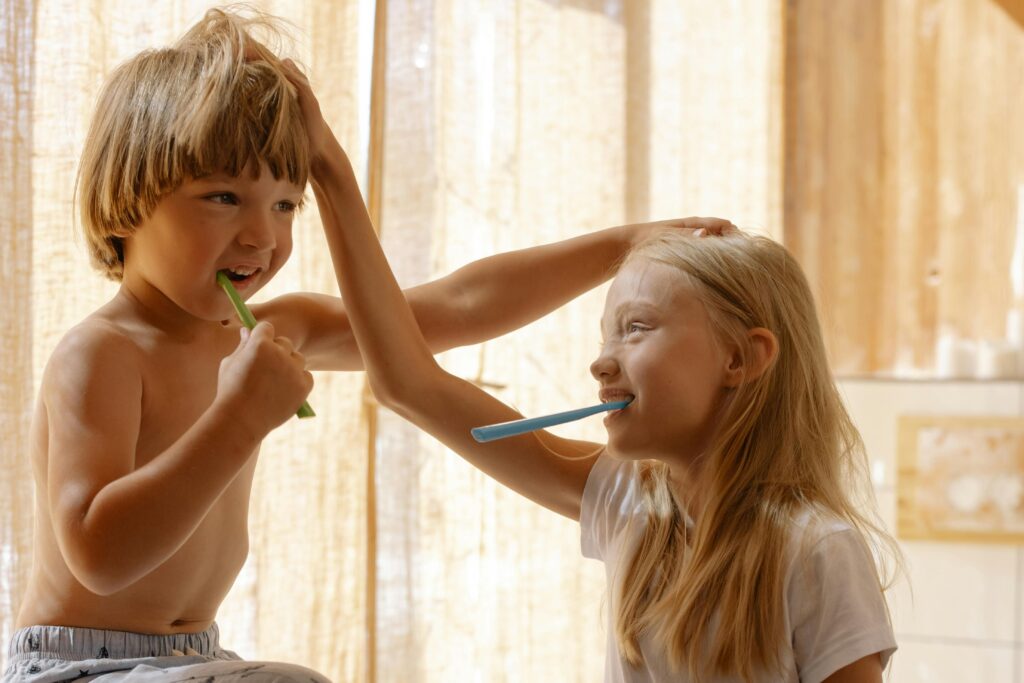 Photo by cottonbro studio: https://www.pexels.com/photo/brother-and-sister-brushing-their-teeth-7086237/