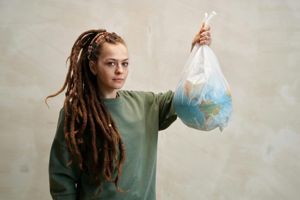 Photo by Julia M Cameron: https://www.pexels.com/photo/a-woman-holding-a-globe-in-a-plastic-6995299/