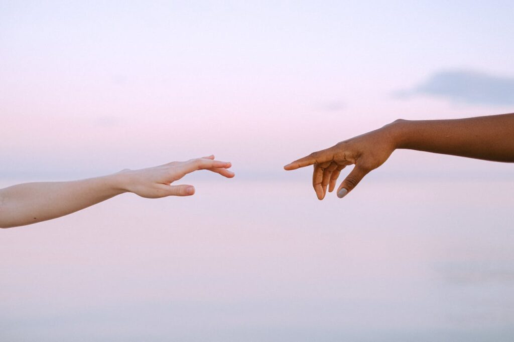 Photo by Anna Shvets: https://www.pexels.com/photo/photo-of-people-reaching-each-other-s-hands-4672717/